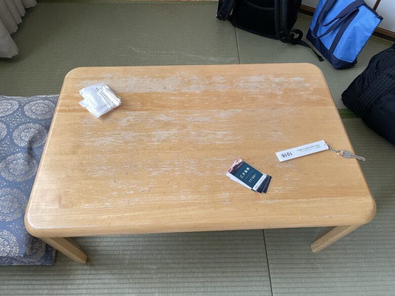 Low table and cushions in front of the TV