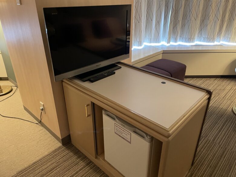 TV stand in the center of the room