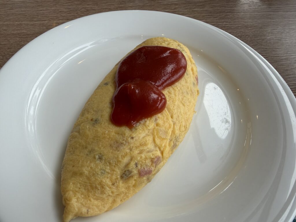 Omelet topped with ketchup